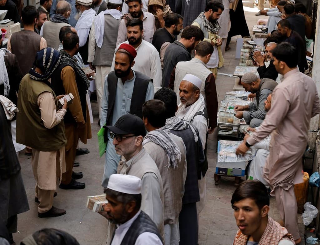 Afghan currency slides sharply as economic crisis bites - December 13, 2021
